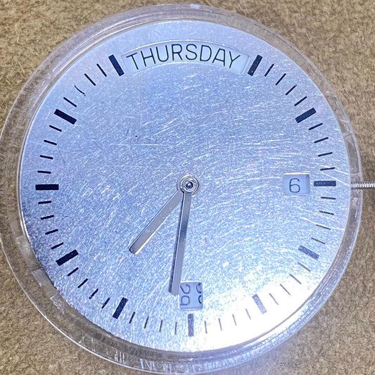 1. China Made 2834-2 automatic mechanical watch movement in silver and gold tones.  