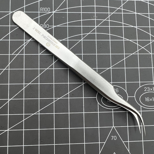 Swiss Bergeon 7026-7 antimagnetic tweezer with fine curved tips for precise watch repair tasks.
