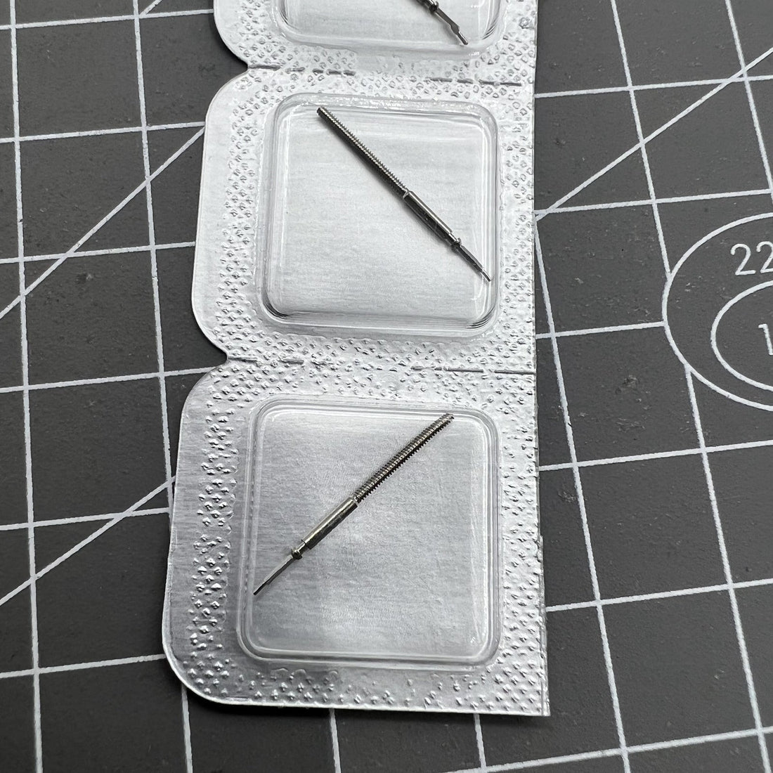 Replacement watch winding stem for ETA F06.111 movement, compatible with precision watch repairs.