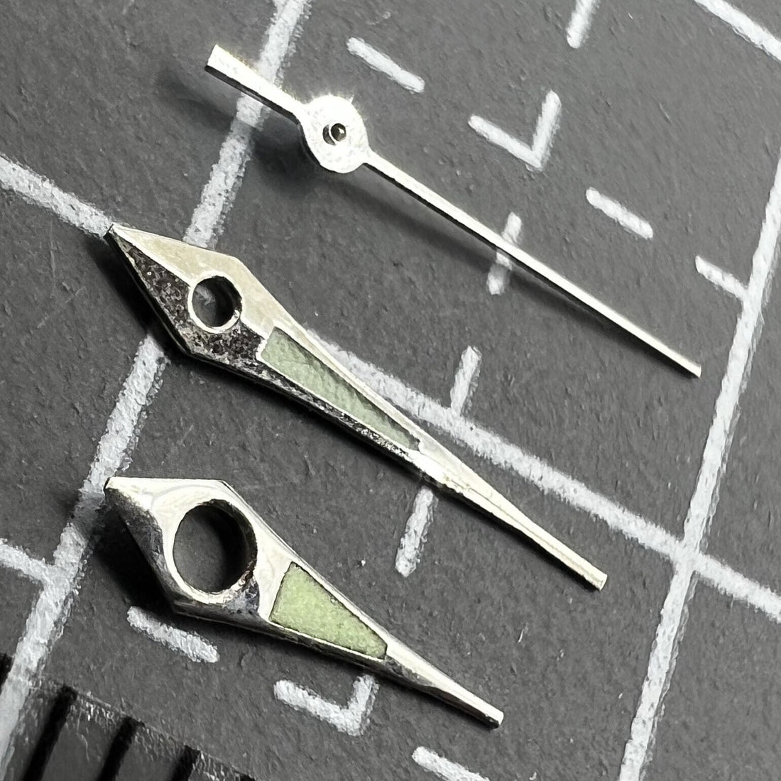 11mm Arrow shape watch hands with silver trim and green lume for Miyota 2035, 2115, 2105 movements.