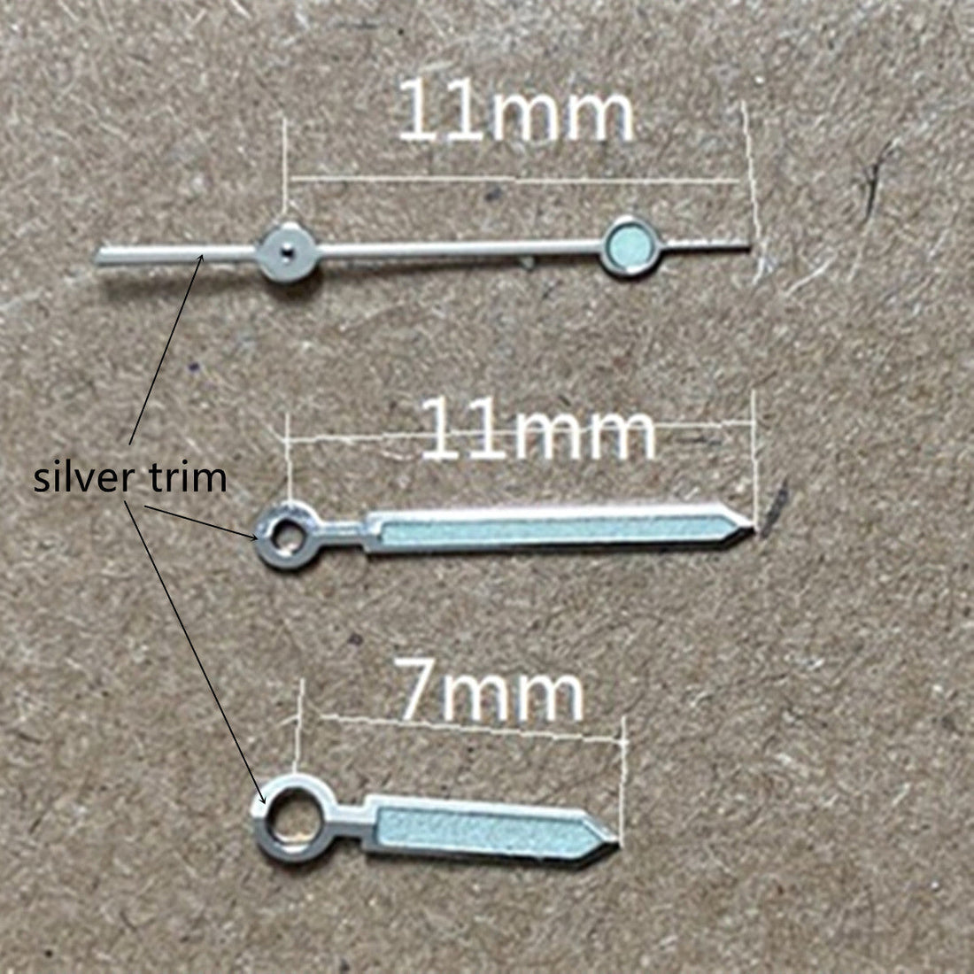 11mm silver-trimmed green luminous watch hands for Miyota 1M12 movement, enhancing readability by BrandName.