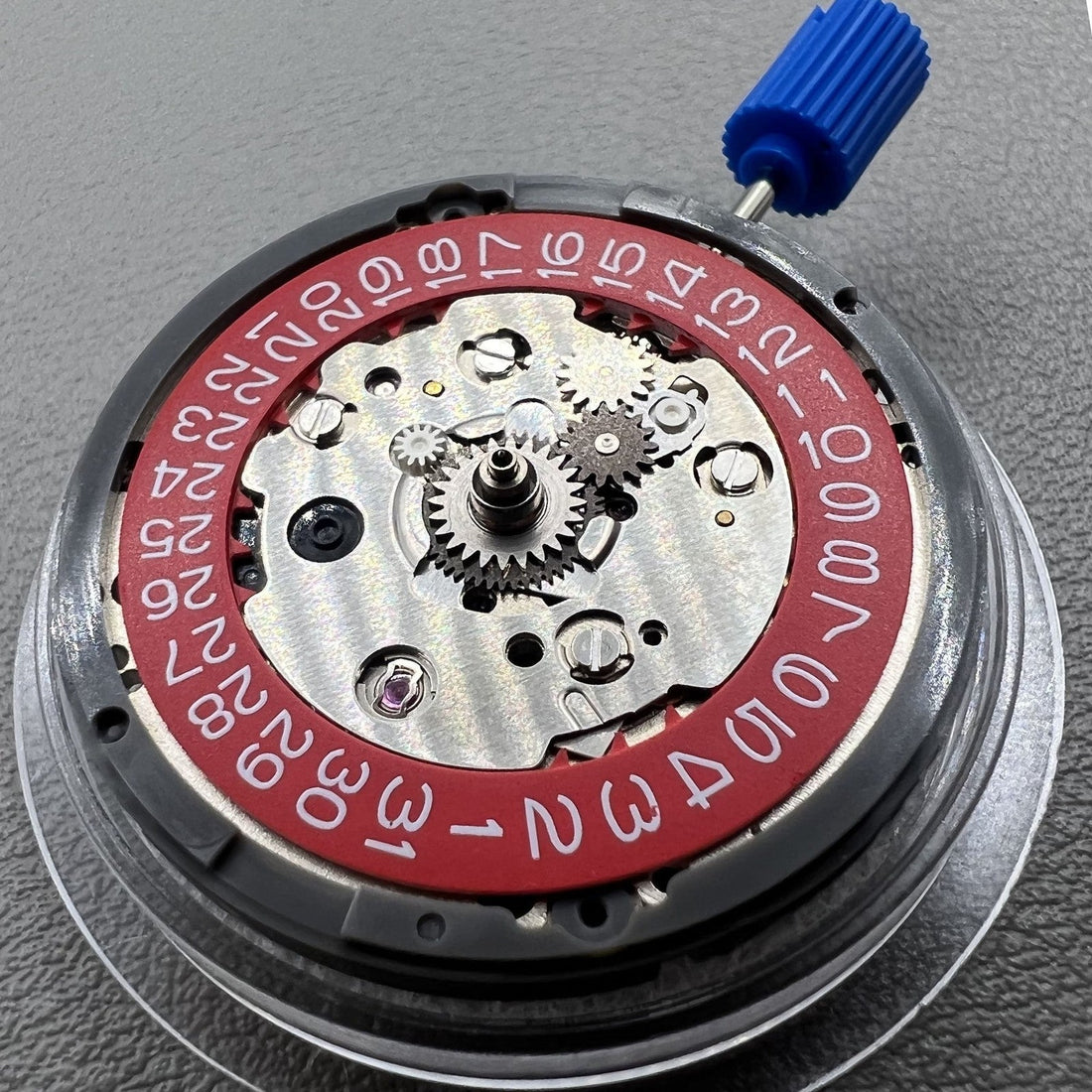 Seiko NH34 GMT watch movement with red disk wheel, automatic mechanical and hacking seconds.