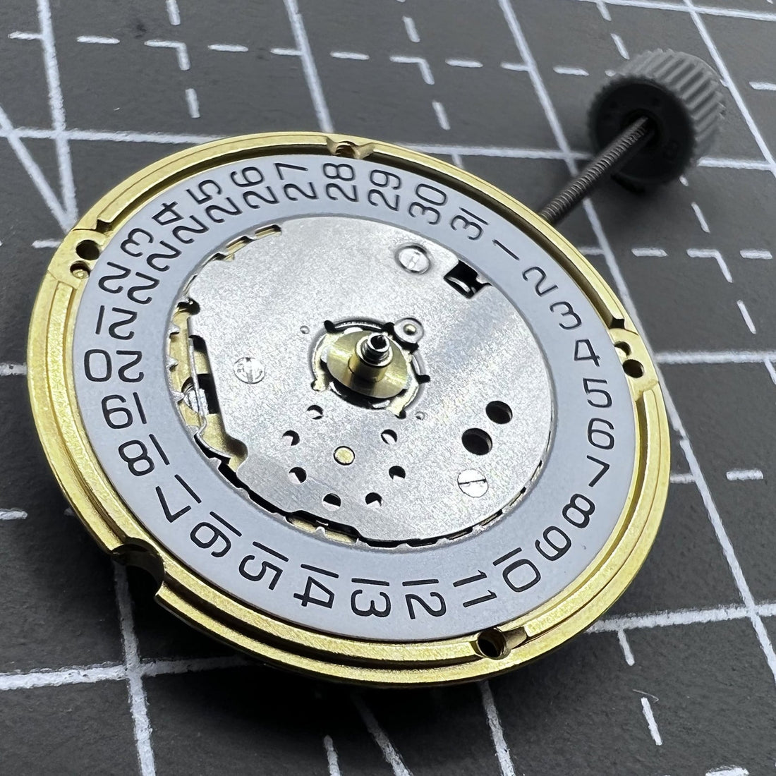 Swiss ETA F04.115 quartz watch movement with 3 hands and date display at 3 o'clock, reliable precision.