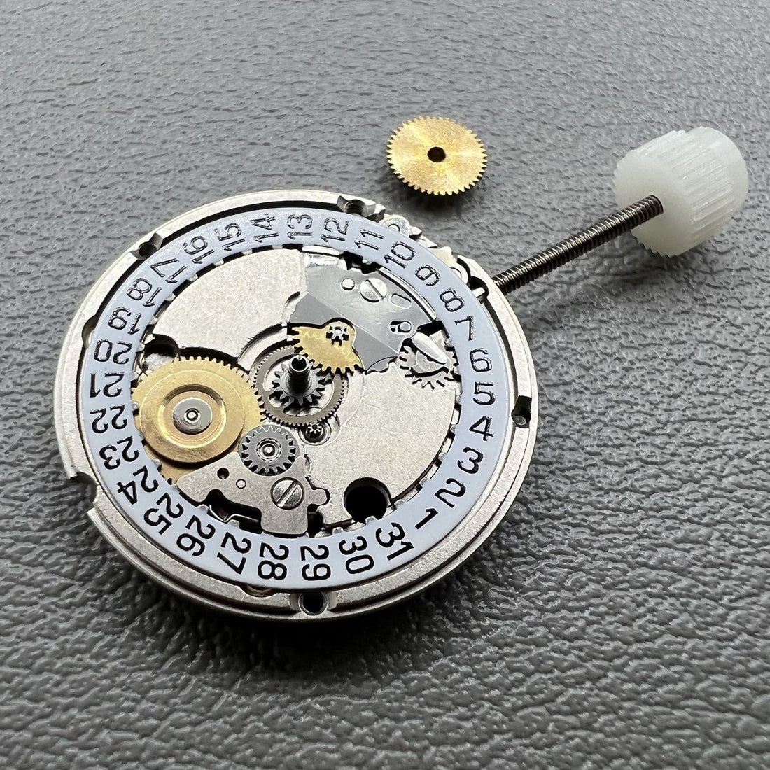 Swiss ETA 556.115 quartz movement with date at 3, 3 hands, precise watch accessory by ETA.