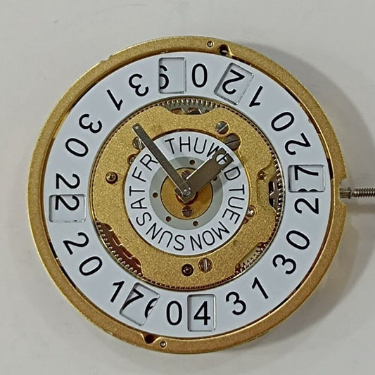 Swiss Made Ronda 5050C watch movement with date at 6, golden gilted finish for watch repair.