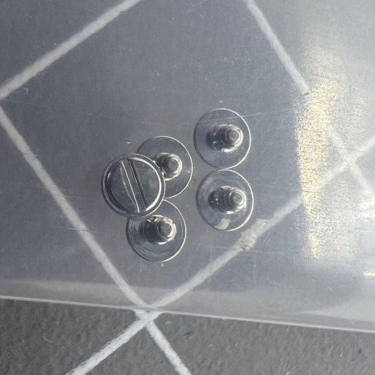 Silver screws securing the rotor oscillating weight for China Made 7750 watch movement components.