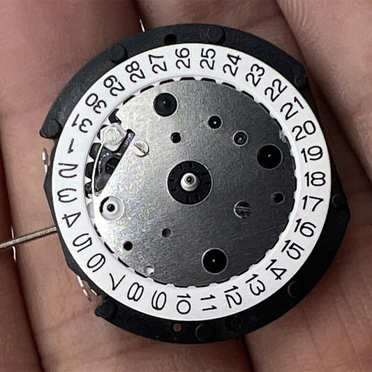 LD57 Quartz watch movement with small second hand at 6, 9, and 12 o'clock positions, perfect for precise repairs.