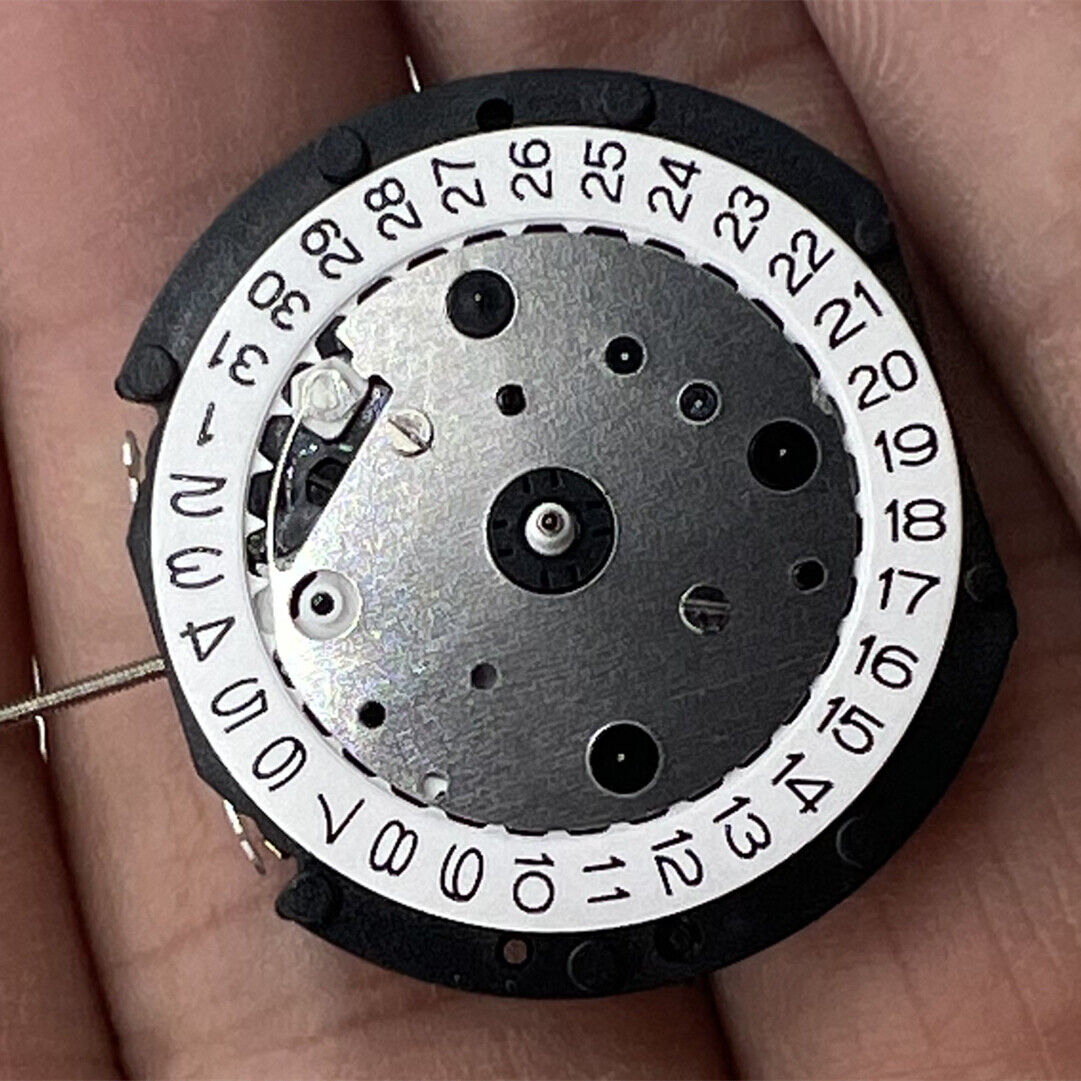 LD57 quartz watch movement with small second hand positioned at 6, 9, or 12 o'clock for repair parts.