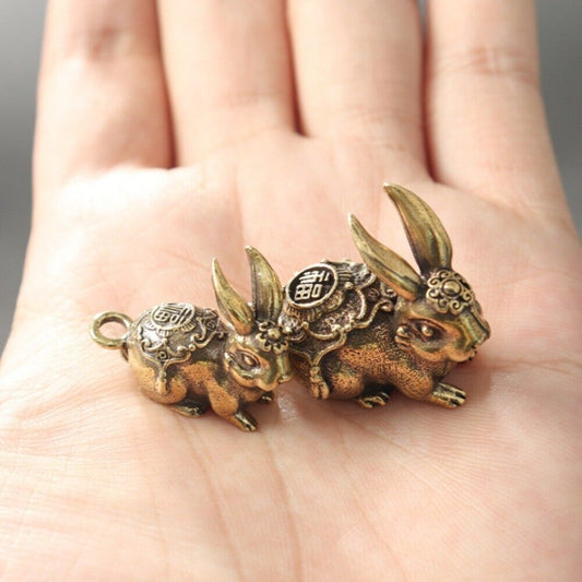 Hand-carved Blessing Rabbit pendant in solid copper, detailed bronze trinket for collectors.