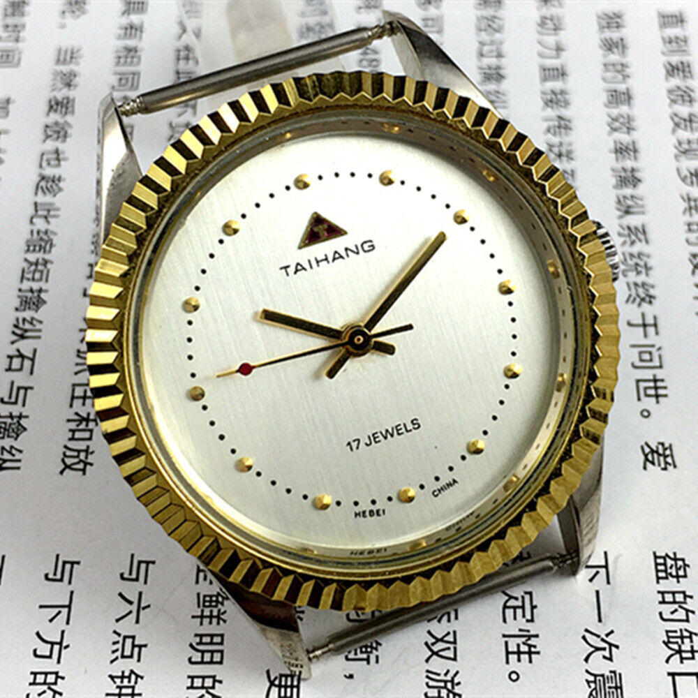 38mm TAIHANG manual watch with silver dial, round case, 3 hands, and 17 jewels for precision.