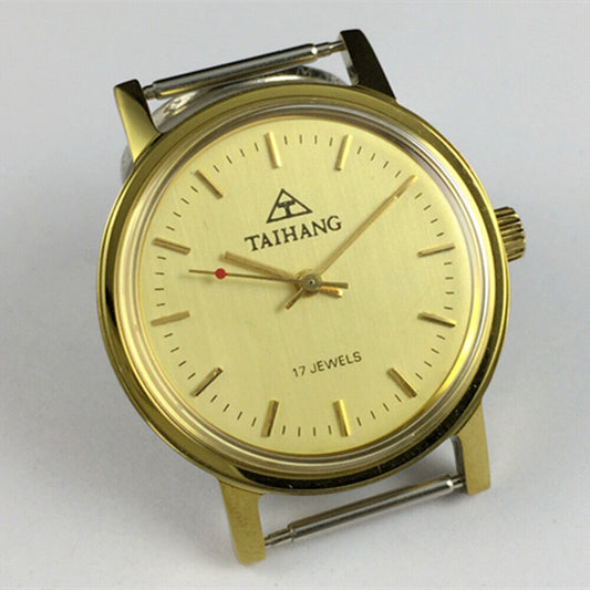 37mm TAIHANG manual mechanical watch with round golden case and yellow dial, featuring gold hour markers.