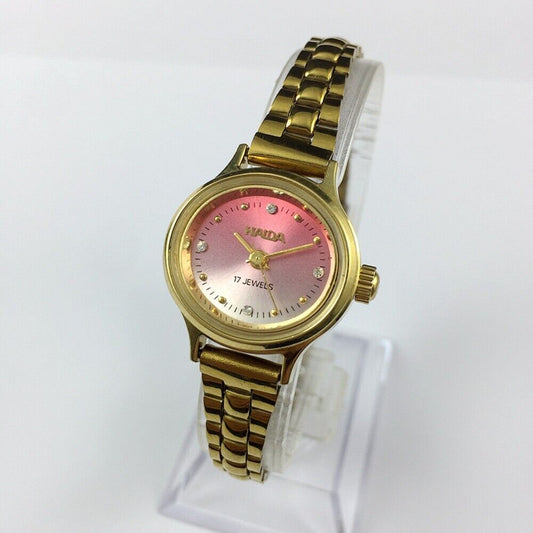 HAIDA 25mm manual mechanical lady watch with golden nail markers, 17 jewels, and gradient pink dial.