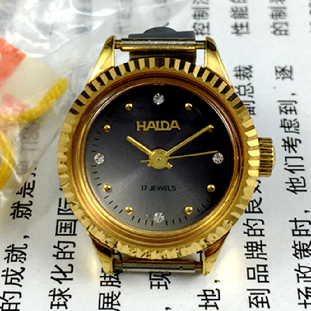 Elegant 24mm HAIDA mechanical lady watch with golden nail markers, grey dial, and 17 jewel movement in a round case.