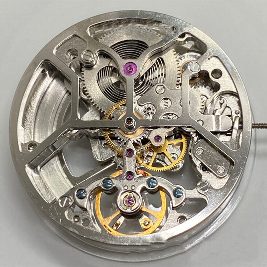 China Made Hollow watch with 3 hands and balance wheel at 6 o?clock, showcasing automatic mechanical movement.
