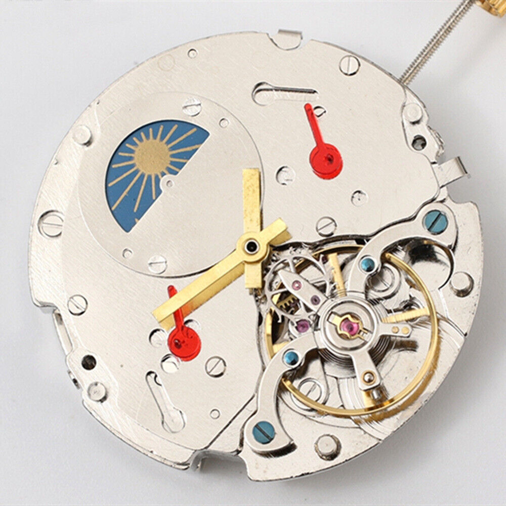 Asian Dandong silver watch with date and moon phase at 3 and 9 o'clock, automatic mechanical movement.