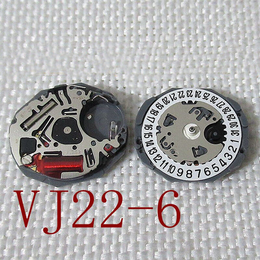 Hattori Epson TMI VJ22 quartz watch movement with date window at 3/6, Japan-made precision mechanism.