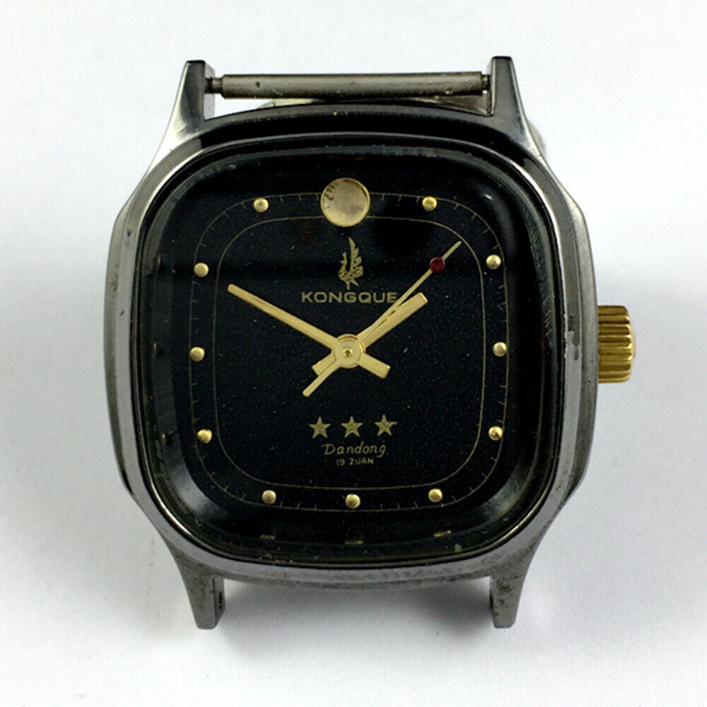 34mm Dandong manual watch with black dial, gold markers, 19 jewels, and three hands for precision timekeeping.