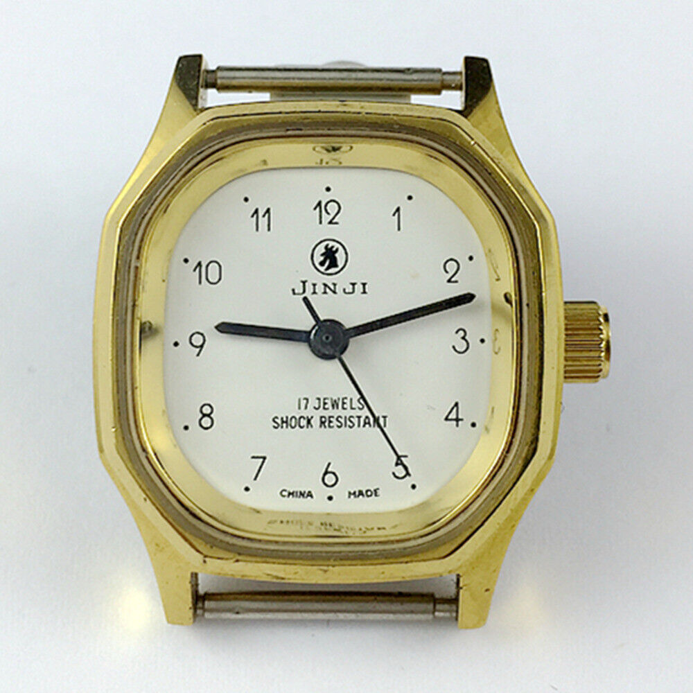SHANGHAI JINJI lady watch with 17 jewels, golden case, and numeral nail markers, elegant mechanical design.