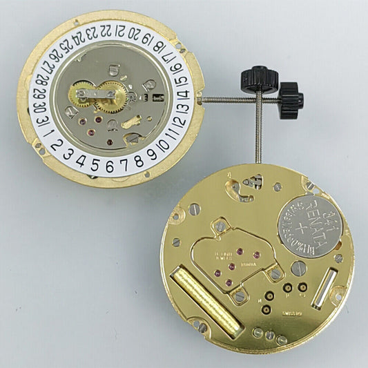 Ronda 1005 Slimtech Swiss quartz watch movement with golden plating and date at 6 o?clock.