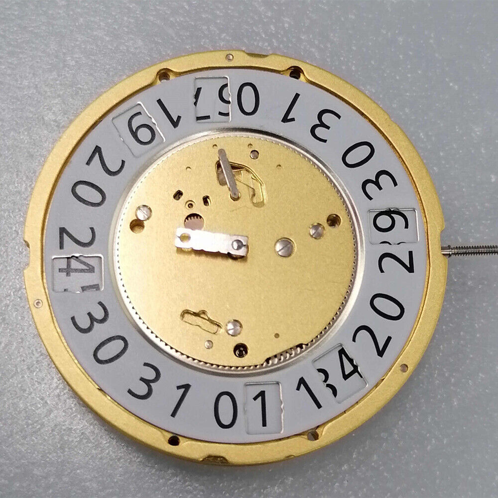 Ronda 7004N quartz watch movement with 2 hands, date at 6, day at 12, golden plated finish.