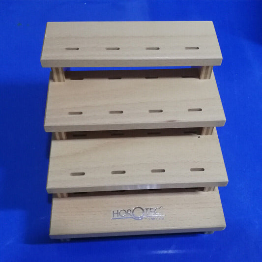 Horotec MSA12.398 wooden storage rack holding 12 tweezers, organizing watch repair tools efficiently.