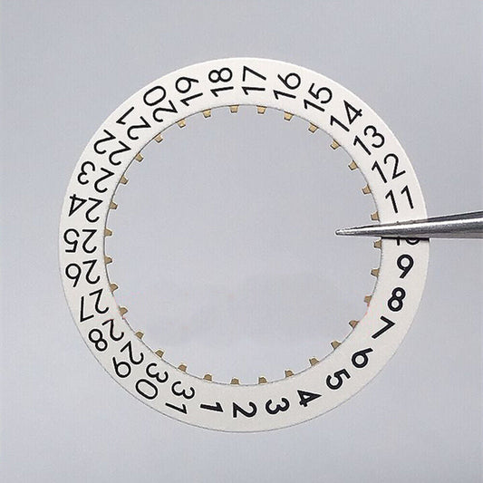 Light white Omega 2500 watch date wheel showing date at 3 o'clock for precise timekeeping