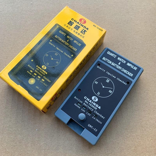 QBC-22 Quartz Watch battery tester by QBC, compact tool for accurate watch battery diagnostics.