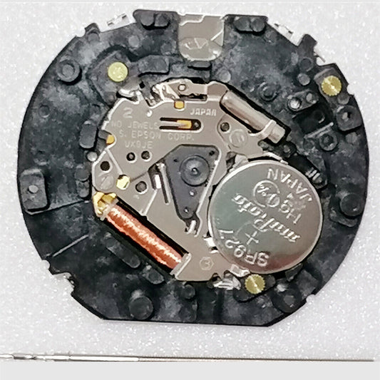 1. Hattori Epson VX9JE quartz watch movement, precision Japan-made component for repairs.  