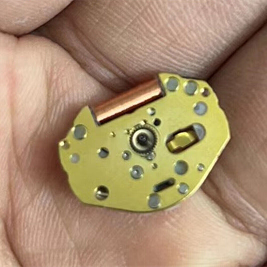Miyota SUPER 2035 quartz movement with golden finish and precision watch stem for repairs.
