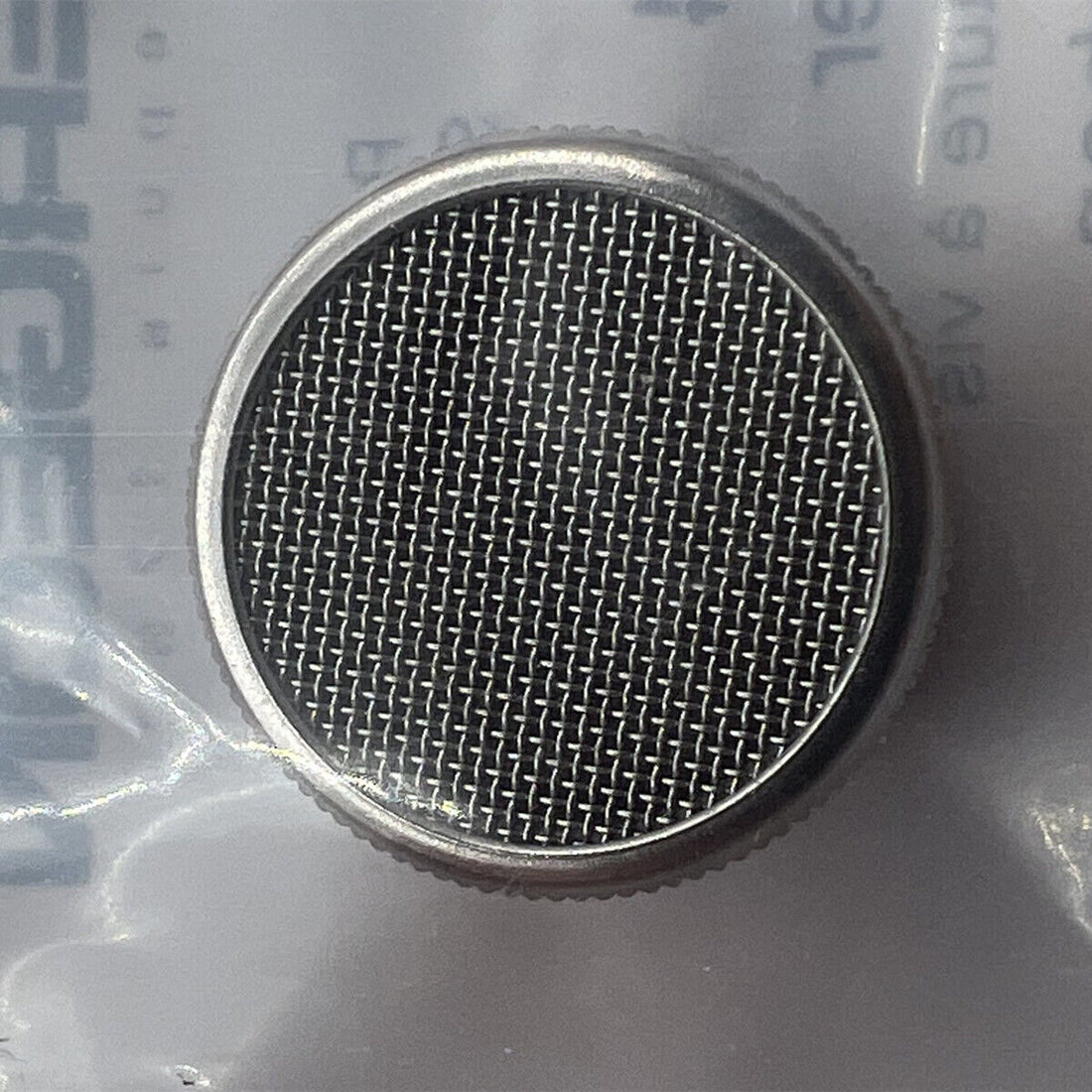 Bergeon 4734 cleaning basket holding 16mm watch parts for precise Swiss watchmaker maintenance.