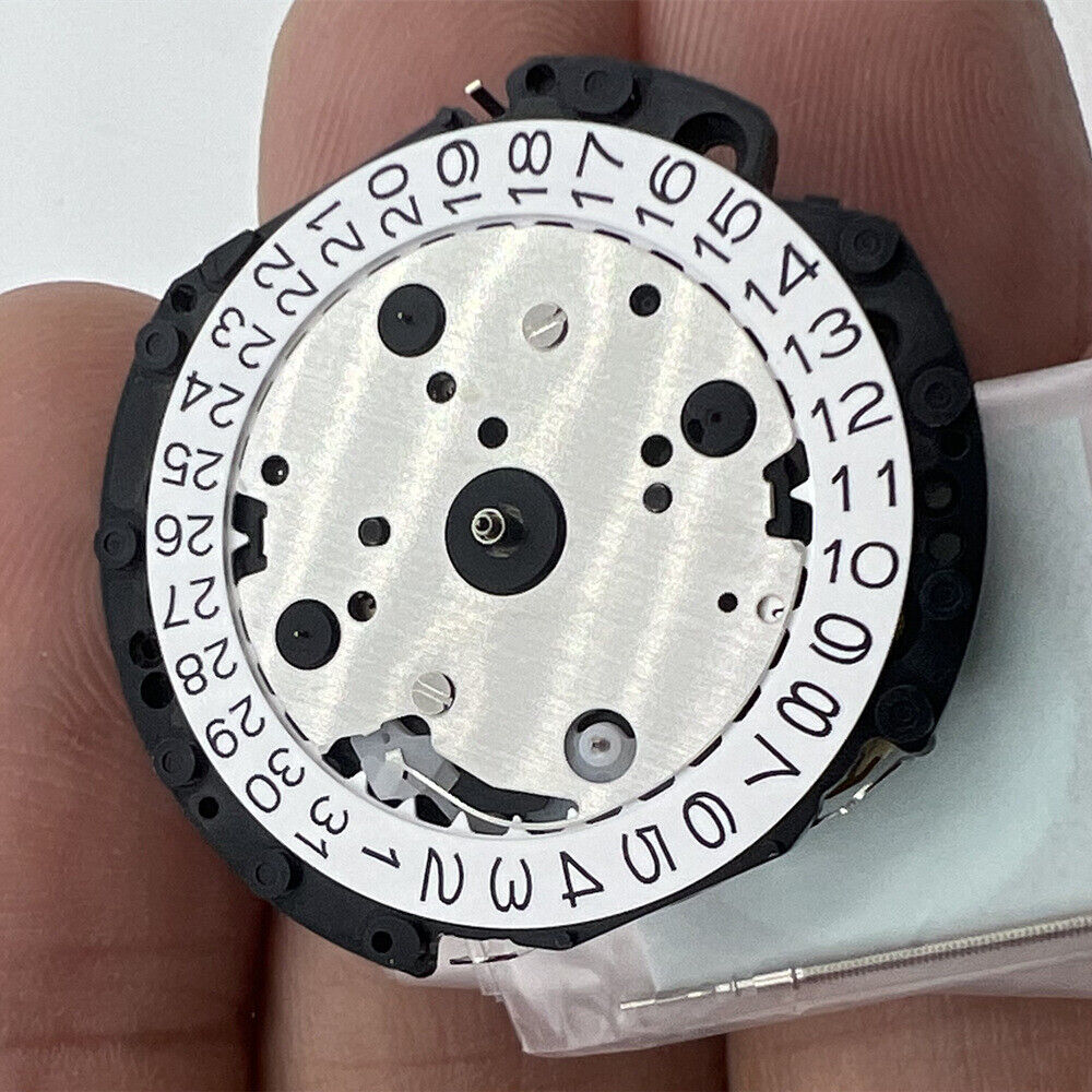 Hattori Epson TMI VD53 quartz watch movement with date at 3, precision Japan-made mechanism