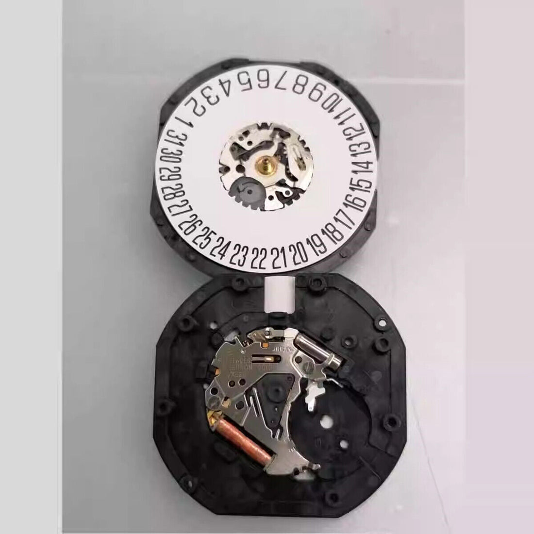 Hattori Epson VX62 quartz watch movement, precision Japan-made mechanism for accurate timekeeping.