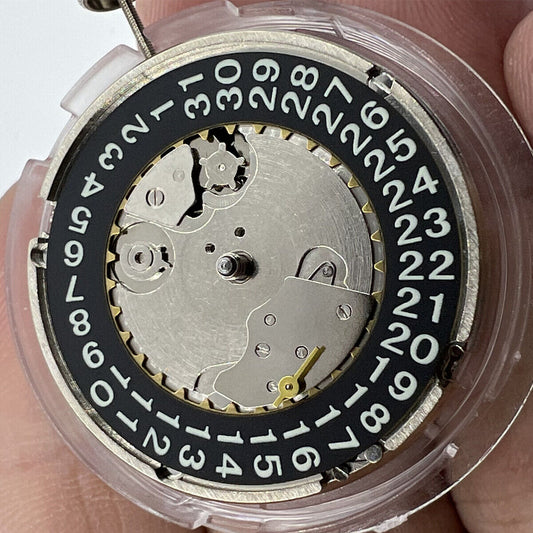 Black Seagull ST2555 automatic watch movement with perlage finish and big date display at 9H.