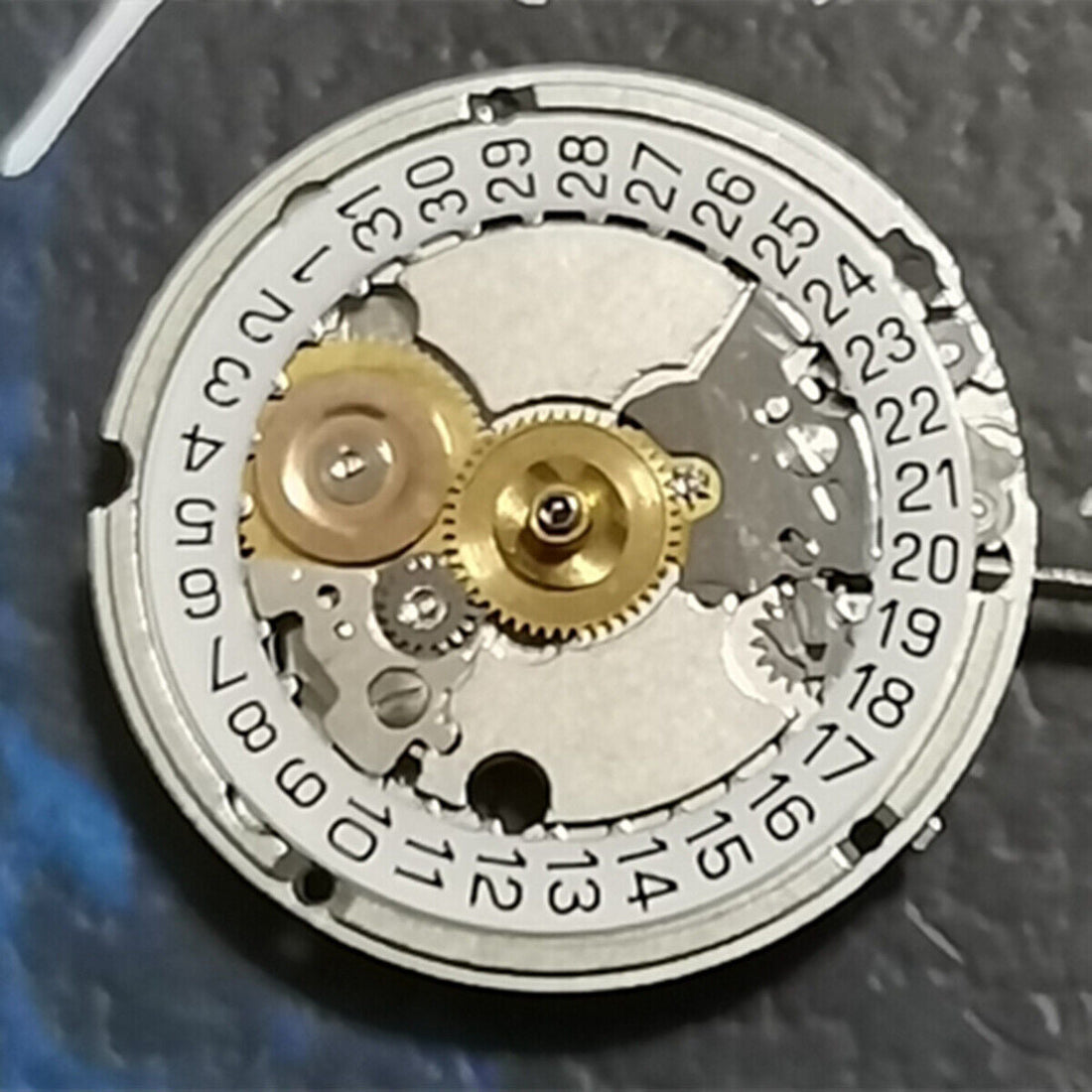 ETA556.115 Swiss Made quartz watch repair part with 3 hands and date at 3 o'clock, precision movement.