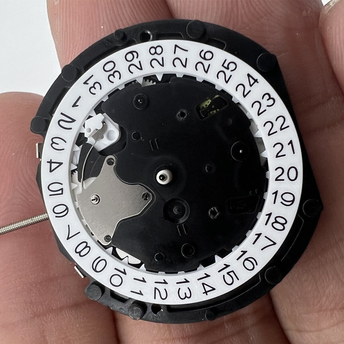Sunon PE90 Quartz watch movement with 3 hands, date at 3, small seconds at 3, 6, and 9 positions.