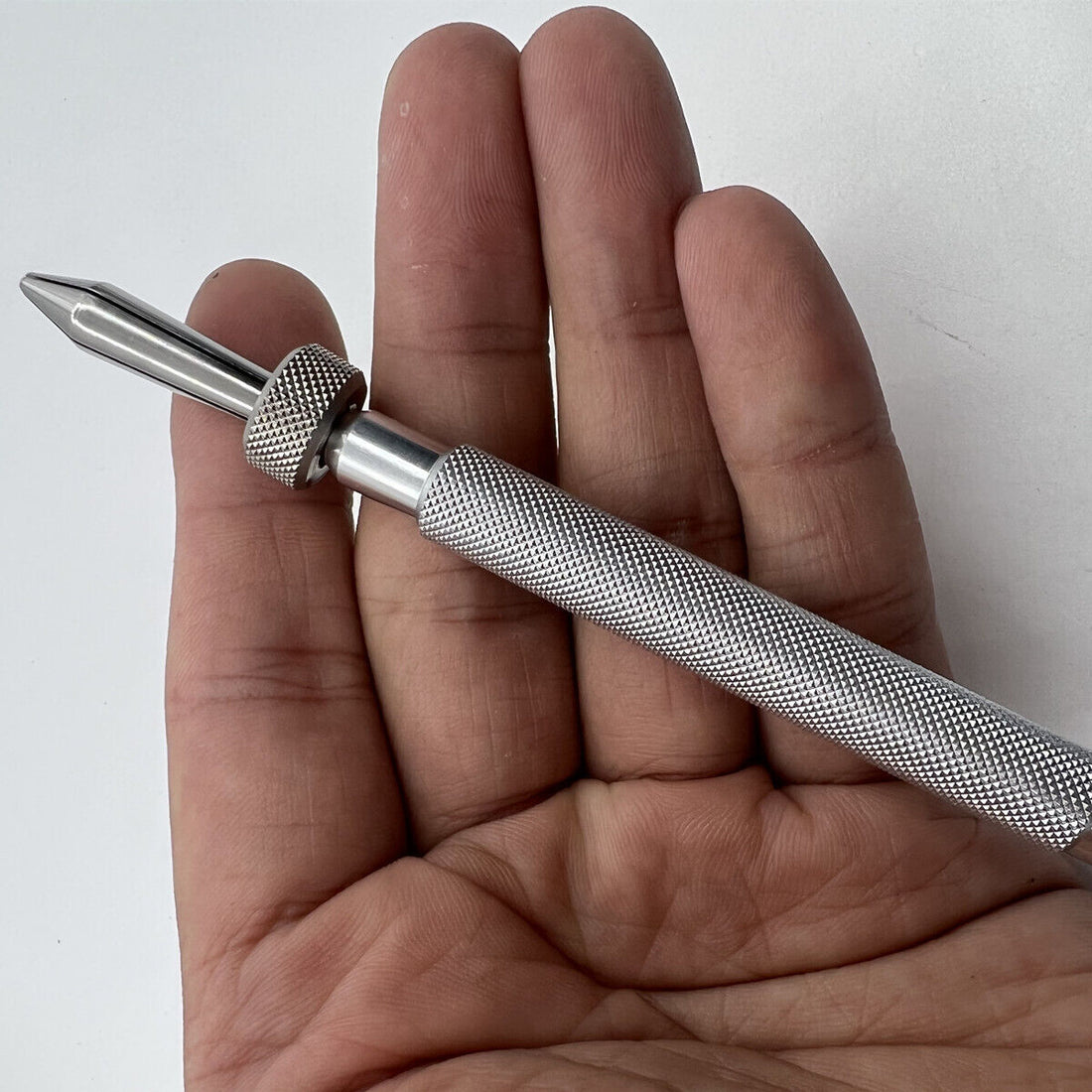 Precision watch part holder clamp tool, ideal for securing crowns and levers during watch repair.