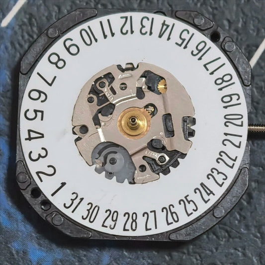Orient Japan HT711 quartz watch part with 3 hands and date at 6 for precise timekeeping.