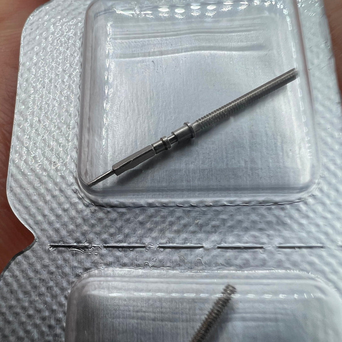 Brand new Omega 8500 watch winding stem for precise movement repair and maintenance.