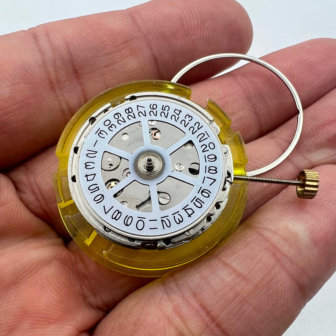 Silver China Made 2813 8205 automatic watch movement showing single calendar at 3 o'clock position