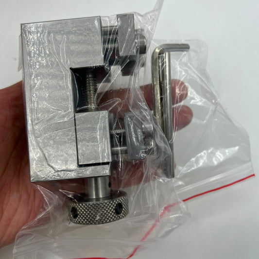 Stainless steel Oyster style link remover tool for precise watch band adjustments.