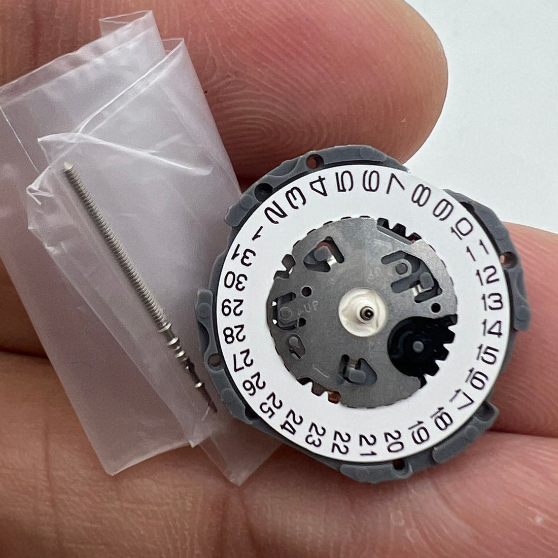 Hattori Epson TMI VJ12 quartz watch movement with date window at 3/6, Japan made quality.