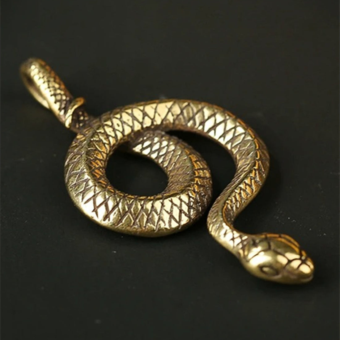 Solid copper snake trinket with vintage hand-carved bronze detailing, perfect for unique decor or gifts.