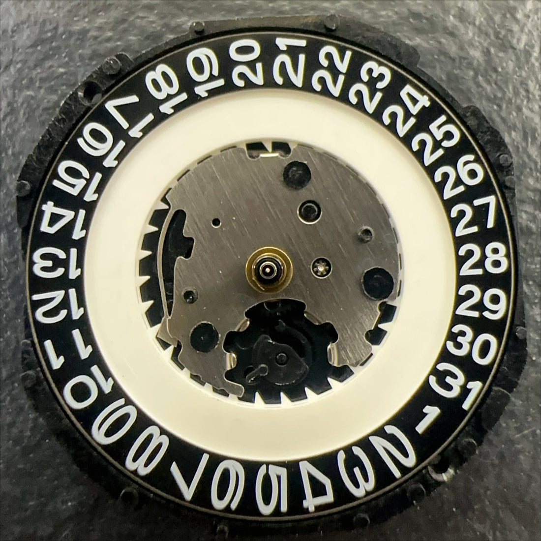 PC32A quartz watch movement with single calendar, black date disk at 3 o'clock by Japan Made brand.