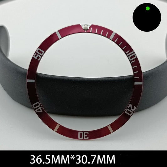 Green lume aluminum watch bezel with dark red slope and white font, 36.5/30.7mm, for precise time tracking.