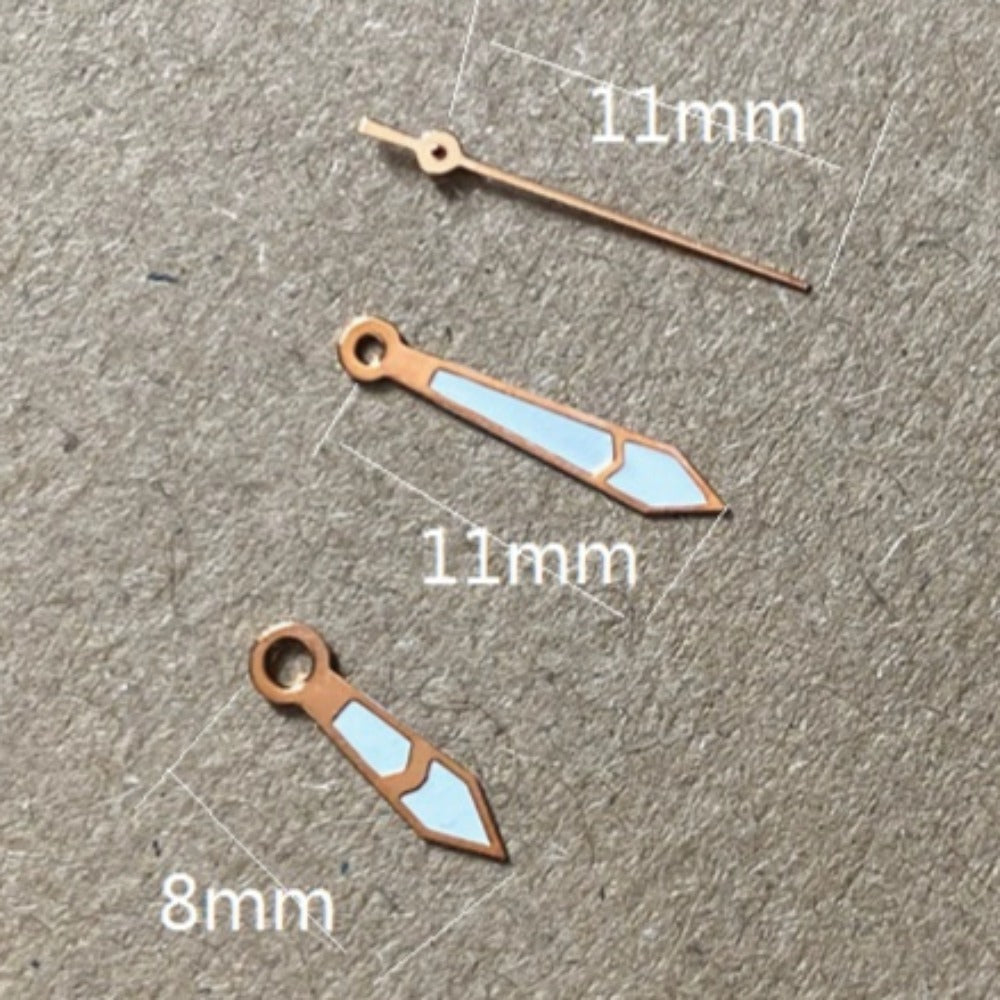 Rose gold arrow-shaped lume watch hands, 11x11x8mm, for Miyota 2035 quartz movement.