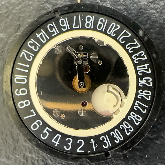 Swiss Made Ronda 515 quartz watch movement with black dial and calendar at 6 o'clock.