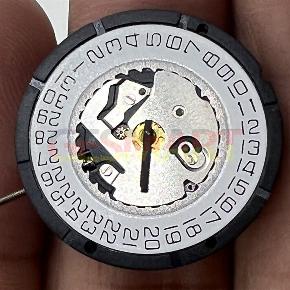 Watchmakers ISA 2330 quartz movement with 3 hands for precise watch repair parts.