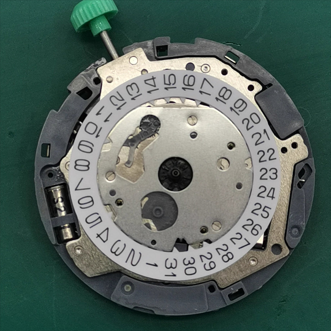 Miyota OS10 quartz watch movement with date display at 3 o'clock, precision Japanese brand component