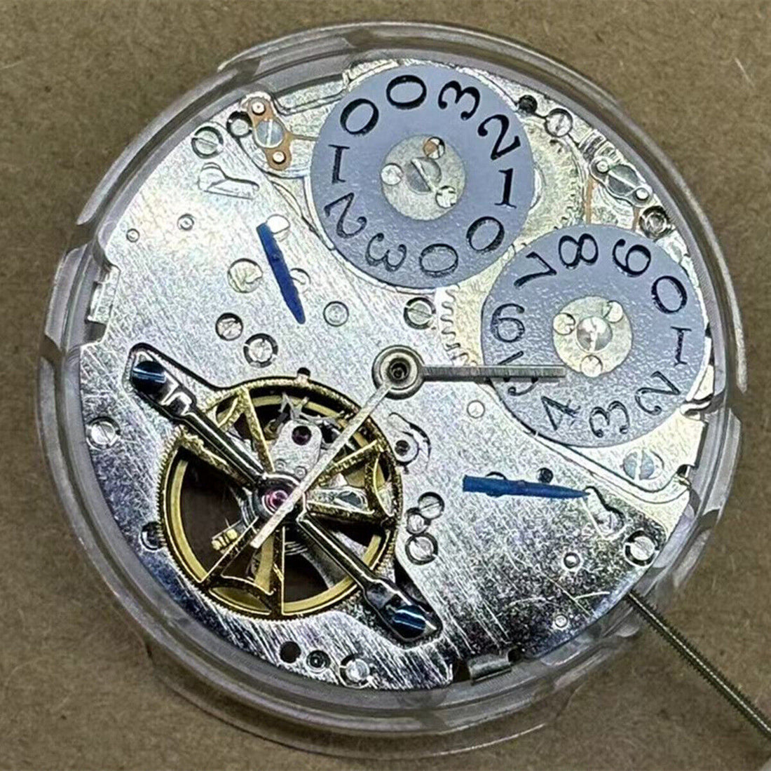 Shanghai watch accessory featuring automatic mechanical movement, big date at 12, and bare flywheel design.