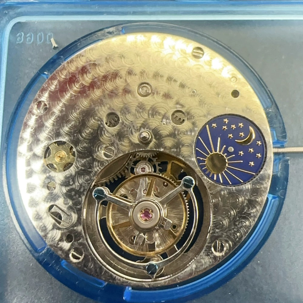 Hangzhou 3310 Flywheel mechanical watch movement, hand-wound precision with intricate carving design.